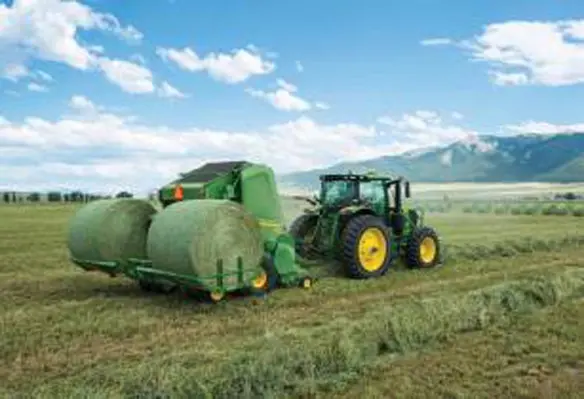 John Deeres A520R Plus2 Accumulator carries up to two round bales behind the baler while the third is made in the chamber. (Image source: John Deere)